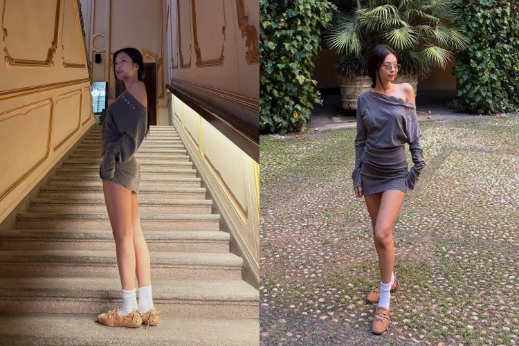   Jennie身穿灰色斜肩洋裝展現隨性與俐落，領口微微下滑營造慵懶氛圍，呼應她一貫的率性時髦態度。