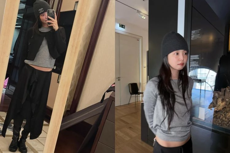 這套造型的關鍵在於同色系灰階的層次運用。Jennie選擇較淺的灰色上衣作為視覺中心，讓整體看起來輕盈、不壓臉，再搭配深灰色毛帽與外套，利用深淺差異自然收斂輪廓。