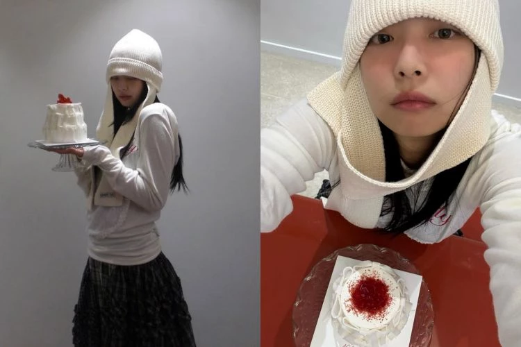 Jennie這套造型把直接毛帽本身當成主角來運用。選擇帶有延伸結構的造型毛帽，帽體不只覆蓋頭部，垂落的帽片自然包住臉側與下顎，直接模糊臉部邊界，讓五官集中在中間區域。