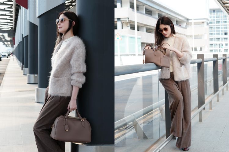 陳慧琳以Loro Piana 2025秋冬造型現身機場，把「保暖＋減齡」示範得既輕盈又高級。柔霧奶茶色的Cherry Hill羊絨外套蓬鬆但不臃腫，輕柔毛感在陽光下呈現柔焦效果，內搭淺色針織毛衣，與外套融成同色系，使臉部更顯乾淨。