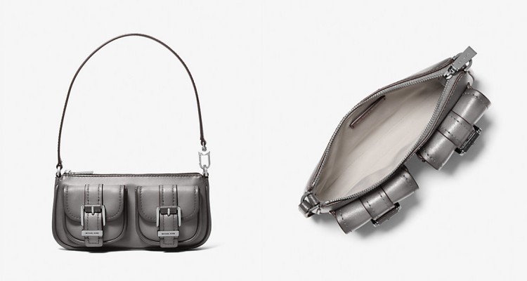Michael Kors Zoe手拿包以復古包扣設計成為亮點,俐落長方比例結合雙前袋裝飾,拋光質感讓包身呈現柔亮金屬光澤,內層容量可放手機、卡夾與唇膏等小物。
