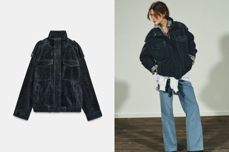 中性寬版輪廓的麂皮夾克，觸感柔韌、表面自帶暖霧般的絨感光澤。高領與長袖保持線條感，胸前翻蓋口袋用按扣固定，開合直覺又維持簡潔立面，內襯提升穿著滑順度並保護麂皮。