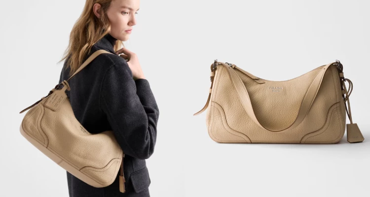 這款全新詮釋的經典「Aimée」包款,以設計向Prada的品牌根源致敬,再次呼應品牌長久以來所擅長的旅行主題。獨特的半月形Hobo流浪包輪廓,因柔韌皮革的豐富層次而展現全新立體感;細緻而略帶不規則的紋理,更讓包款呈現自然又精緻的高級質感。