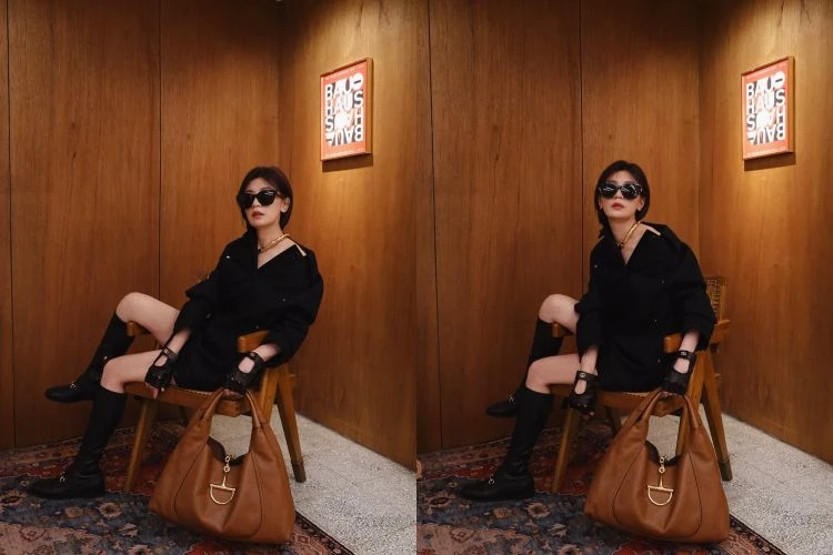 賈靜雯全黑造型展現強勢魅力，手上的Gucci Soft Bit包成為亮點。以一件剪裁俐落的黑色長版襯衫打造「下半身失蹤」的時髦比例，搭配皮革長靴與騎士風手套，大框墨鏡與金屬頸圈則讓整體風格更顯高級戲劇張力。