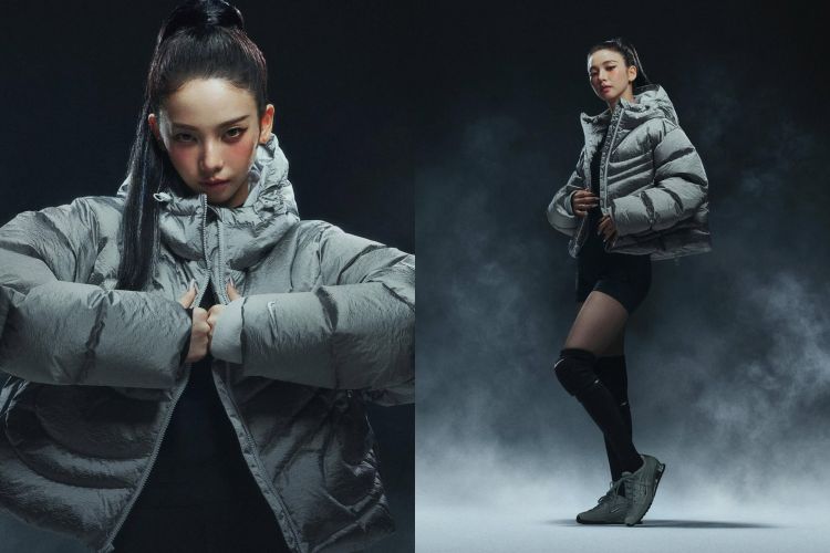 Karina穿上的是Nike灰色羽絨短版外套，以霧面灰色呈現，線條俐落、澎度集中在肩線與手臂，讓外套本身就帶有力量感。