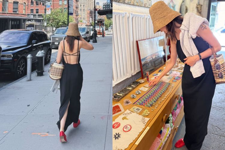 黑色細肩長洋裝線條簡約，後背的交叉設計增添一絲性感與率性，搭配草編包與遮陽帽，瞬間帶出度假氛圍。