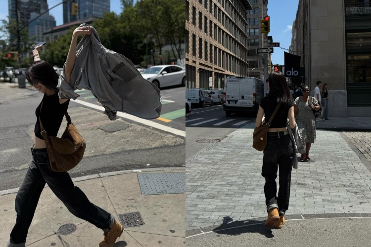 謝盈萱以短版上衣搭配低腰牛仔褲現身街頭，極簡黑踢勾勒出俐落線條，微露腰線讓比例更修長，同時散發自在自信的魅力。