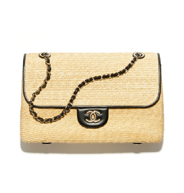 黑色編織飾以皮革口蓋包。