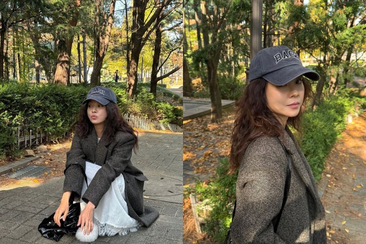 宋智孝這套造型讓人一眼就看見深灰棒球帽搭配自然蓬鬆的捲髮，先把整體氛圍拉向輕鬆、戶外感十足的少女氛圍，而外層那件寬版西裝大衣則穩住比例，帶出俐落氣場，不會因為休閒而顯得隨便。